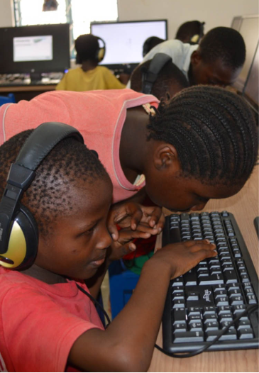 2 children using computer keyboard