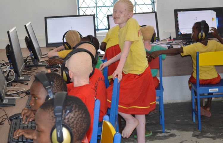 A photo of a group of students using computers in one of the inABLE Assistive Technology Labs