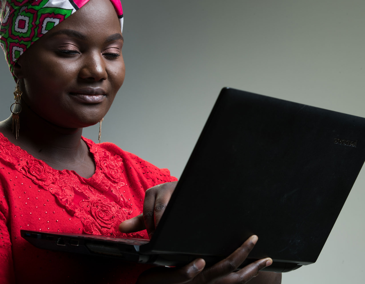 Valerie Busaka, an inABLE computer Instructor using a laptop