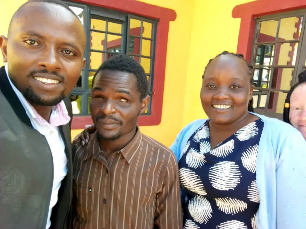 ANTHONY NJOROGE (Left), DAVID MUTUGI (Center), AND KARIMI KAUNTY (Right), RADIO HOST, WERU FM AND AN UNIDENTIFIED PERSON AT FAR RIGHT APPEAR IN THIS SELFIE PICTURE.