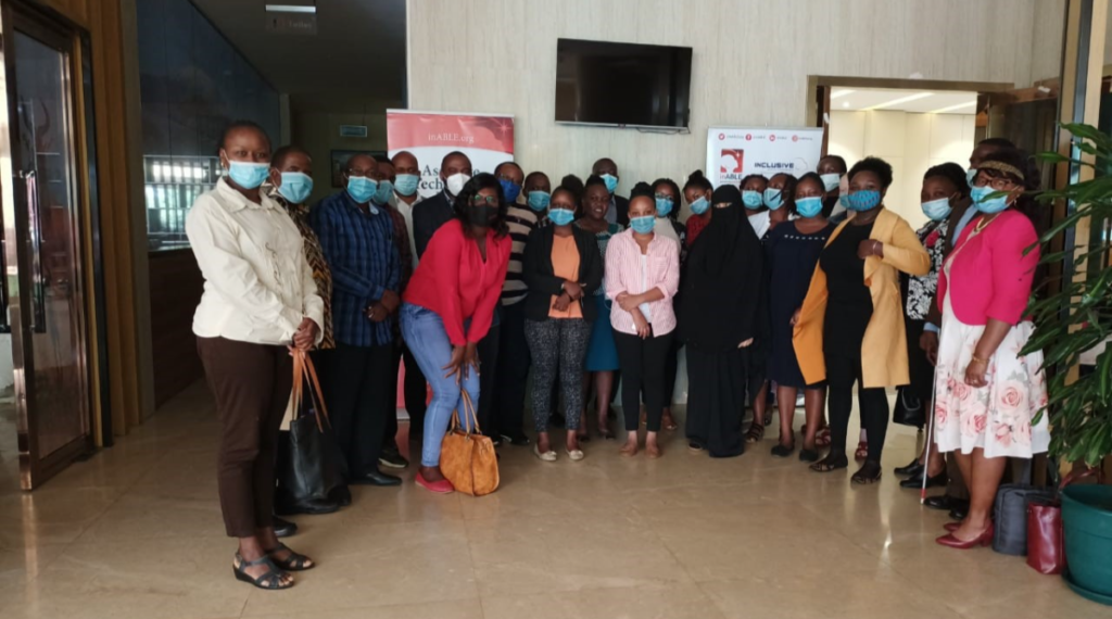 A group of publisher attending the inABLE Digital Accessibility workshop pose for a picture wearing face masks.