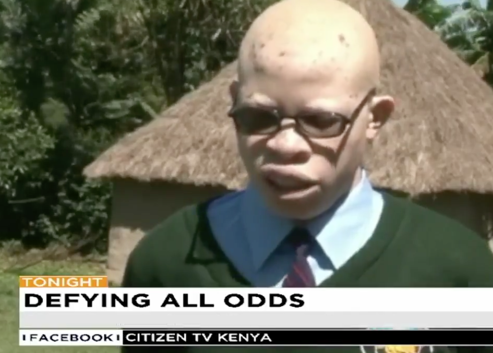 A screen shot of Collins Maikuva Shamala, who is in front of thatched roof cottage, speaking on Citizen TV Kenya.