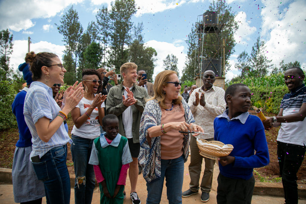 The team joined with students and teachers clapping in celebration after the launch